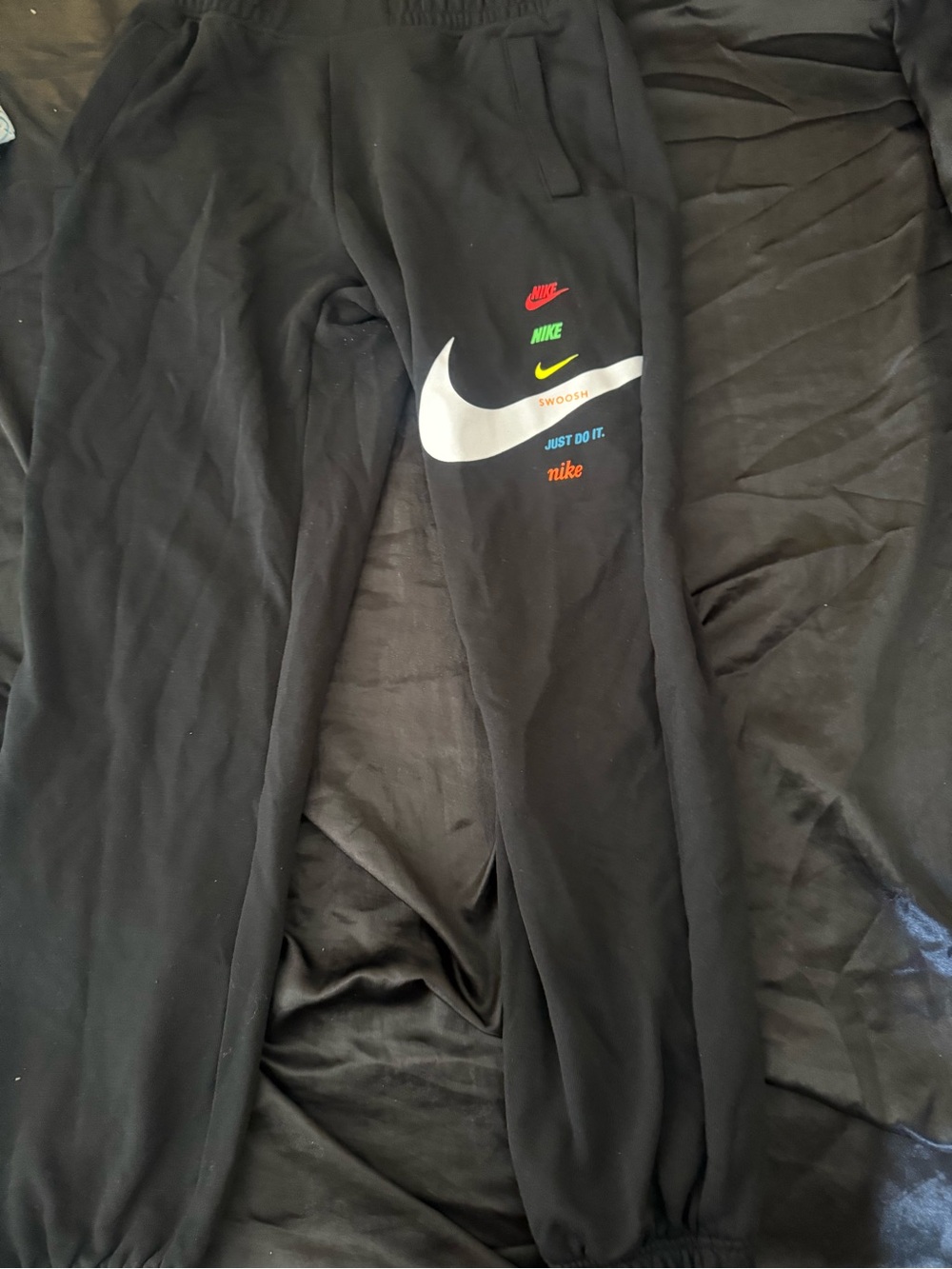 Nike women Black Jogger Sweatpants with White Swoosh and Multicolor Logos